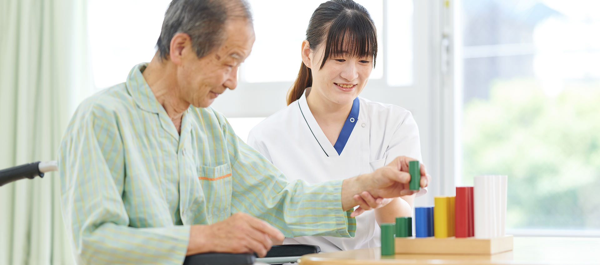 患者とリハビリテーションスタッフ